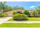 Charming home with a well-manicured lawn, beautiful landscaping, and a convenient two-car garage at 6093 Sabal Creek Blvd, Port Orange, FL 32128