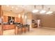Modern kitchen island features sleek countertop and barstool seating, seamlessly blending with living area at 6093 Sabal Creek Blvd, Port Orange, FL 32128