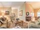 Cozy living room featuring neutral colors, elegant rug, and comfortable seating at 6093 Sabal Creek Blvd, Port Orange, FL 32128