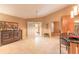 Open living room features a kitchen bar, tile floors, high ceilings and backyard access at 6093 Sabal Creek Blvd, Port Orange, FL 32128