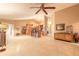 Open floor plan living room and kitchen area with tiled floors and high ceiling at 6093 Sabal Creek Blvd, Port Orange, FL 32128