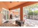 Inviting patio with brick flooring, outdoor furniture, and screen enclosure at 6093 Sabal Creek Blvd, Port Orange, FL 32128