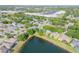 Wide aerial shot of a quiet residential neighborhood, backs up to serene lake at 634 Woodford Dr, Debary, FL 32713