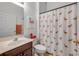 Bathroom featuring a vanity and a flamingo-themed shower curtain at 634 Woodford Dr, Debary, FL 32713