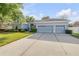 Charming single-story home with well-manicured landscaping and a spacious three-car garage at 634 Woodford Dr, Debary, FL 32713