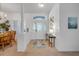 Bright foyer featuring tiled floors, a decorative front door and white walls at 634 Woodford Dr, Debary, FL 32713