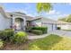 Charming single-story home featuring a three-car garage and beautifully landscaped front yard at 634 Woodford Dr, Debary, FL 32713