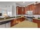 Kitchen with granite countertops, stainless steel appliances, and ample cabinet space at 634 Woodford Dr, Debary, FL 32713