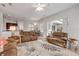 Comfortable living area with neutral tones and easy access to the kitchen and dining area at 634 Woodford Dr, Debary, FL 32713