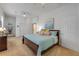 Bright main bedroom features a ceiling fan, neutral walls, plush carpet and ensuite bathroom at 634 Woodford Dr, Debary, FL 32713