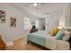 Bright main bedroom features a ceiling fan, neutral walls, plush carpet and ensuite bathroom at 634 Woodford Dr, Debary, FL 32713