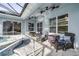 Relaxing outdoor patio featuring comfortable seating with ceiling fans for optimal comfort at 634 Woodford Dr, Debary, FL 32713