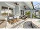 Covered patio with outdoor seating and a spa at 634 Woodford Dr, Debary, FL 32713