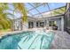 Enclosed pool and spa with sun-drenched patio, perfect for relaxation and entertaining at 634 Woodford Dr, Debary, FL 32713
