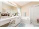 Bright bathroom with a vanity, a soaking tub, and a glass-enclosed shower at 6403 Adrianne Ct, Port Orange, FL 32128