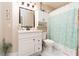 Bathroom featuring white vanity, large mirror, tile floors, and shower with curtain at 6403 Adrianne Ct, Port Orange, FL 32128