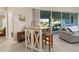 Cozy breakfast nook area with access to an outdoor patio through sliding glass doors at 6403 Adrianne Ct, Port Orange, FL 32128