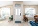 Bright foyer with a large front door, neutral walls, and plenty of natural light from the windows at 6403 Adrianne Ct, Port Orange, FL 32128