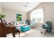 Cozy living room featuring vaulted ceilings, a comfortable sofa, and a large window with sheer curtains at 6403 Adrianne Ct, Port Orange, FL 32128