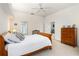 Inviting bedroom features white bedding, neutral walls, and carpet flooring at 6436 Longlake Dr, Port Orange, FL 32128