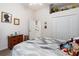 Comfortable bedroom featuring a ceiling fan, and a window overlooking the outdoors at 6436 Longlake Dr, Port Orange, FL 32128