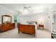 Cozy bedroom featuring tray ceiling and a window view of the outdoors for serene natural light at 6436 Longlake Dr, Port Orange, FL 32128