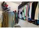Well-organized walk-in closet features shelving and hanging space for clothing storage at 6436 Longlake Dr, Port Orange, FL 32128