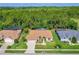 Lovely home featuring manicured landscaping, a paved driveway, and a screened-in lanai at 6436 Longlake Dr, Port Orange, FL 32128