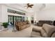Spacious living room features sliding glass doors to the lanai and pool, enhancing indoor/outdoor living at 6436 Longlake Dr, Port Orange, FL 32128