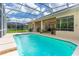 Enjoy the screened-in pool with ample lounging space, perfect for relaxation and outdoor enjoyment at 6436 Longlake Dr, Port Orange, FL 32128