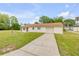 Charming single-story home featuring a well-maintained lawn and an attached one car garage at 701 West St, New Smyrna Beach, FL 32168