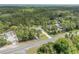 Expansive view of the home's position among wooded land and a paved road at 703 Volco Rd, Edgewater, FL 32141