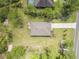 Birds-eye view of the property, highlighting its layout, landscaping, and surrounding neighborhood at 703 Volco Rd, Edgewater, FL 32141