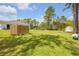 Wide backyard featuring trees, privacy fence, and space for outdoor activities at 703 Volco Rd, Edgewater, FL 32141