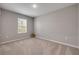 Neutral bedroom with a large window that provides natural light at 703 Volco Rd, Edgewater, FL 32141