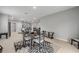 Open concept dining area with view into the living room and kitchen at 703 Volco Rd, Edgewater, FL 32141