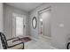 Inviting foyer featuring a decorative glass door, and neutral tones at 703 Volco Rd, Edgewater, FL 32141