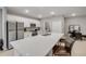 Contemporary kitchen with white cabinets, stainless steel appliances, a large island, and tile flooring at 703 Volco Rd, Edgewater, FL 32141