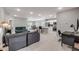Spacious open-concept living area with tile floors, seamlessly connecting to the kitchen at 703 Volco Rd, Edgewater, FL 32141