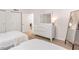 Bedroom with two beds, modern dresser and full length mirror at 705 N Atlantic Ave # 4030, New Smyrna Beach, FL 32169