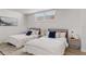 Bright bedroom featuring two beds, modern décor, and a window offering natural light at 705 N Atlantic Ave # 4030, New Smyrna Beach, FL 32169