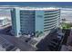The exterior of this beautiful condo building features many floors, parking, and beach access at 705 N Atlantic Ave # 4030, New Smyrna Beach, FL 32169