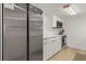 Bright kitchen with white cabinets and countertops, stainless steel appliances, and wood floors at 705 N Atlantic Ave # 4030, New Smyrna Beach, FL 32169