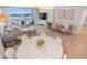 Open-concept living area with a marble table, comfy seating, and stunning ocean views at 705 N Atlantic Ave # 4030, New Smyrna Beach, FL 32169