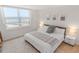 Bright main bedroom with ocean views, a king bed, and stylish décor at 705 N Atlantic Ave # 4030, New Smyrna Beach, FL 32169