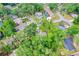 A high angle view showcasing a home nestled among lush foliage in a quiet neighborhood at 795 Sugar Cane Ln, Port Orange, FL 32129