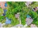 Aerial view of a home with mature trees and a generous lot size at 795 Sugar Cane Ln, Port Orange, FL 32129