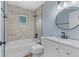 Updated bathroom with modern vanity, tub, stylish tile surround, and matte black hardware at 795 Sugar Cane Ln, Port Orange, FL 32129