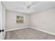 Bright bedroom with neutral walls, carpet and a window providing natural light at 795 Sugar Cane Ln, Port Orange, FL 32129