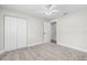 Bedroom featuring a ceiling fan, carpeting, and a closet with double doors at 795 Sugar Cane Ln, Port Orange, FL 32129